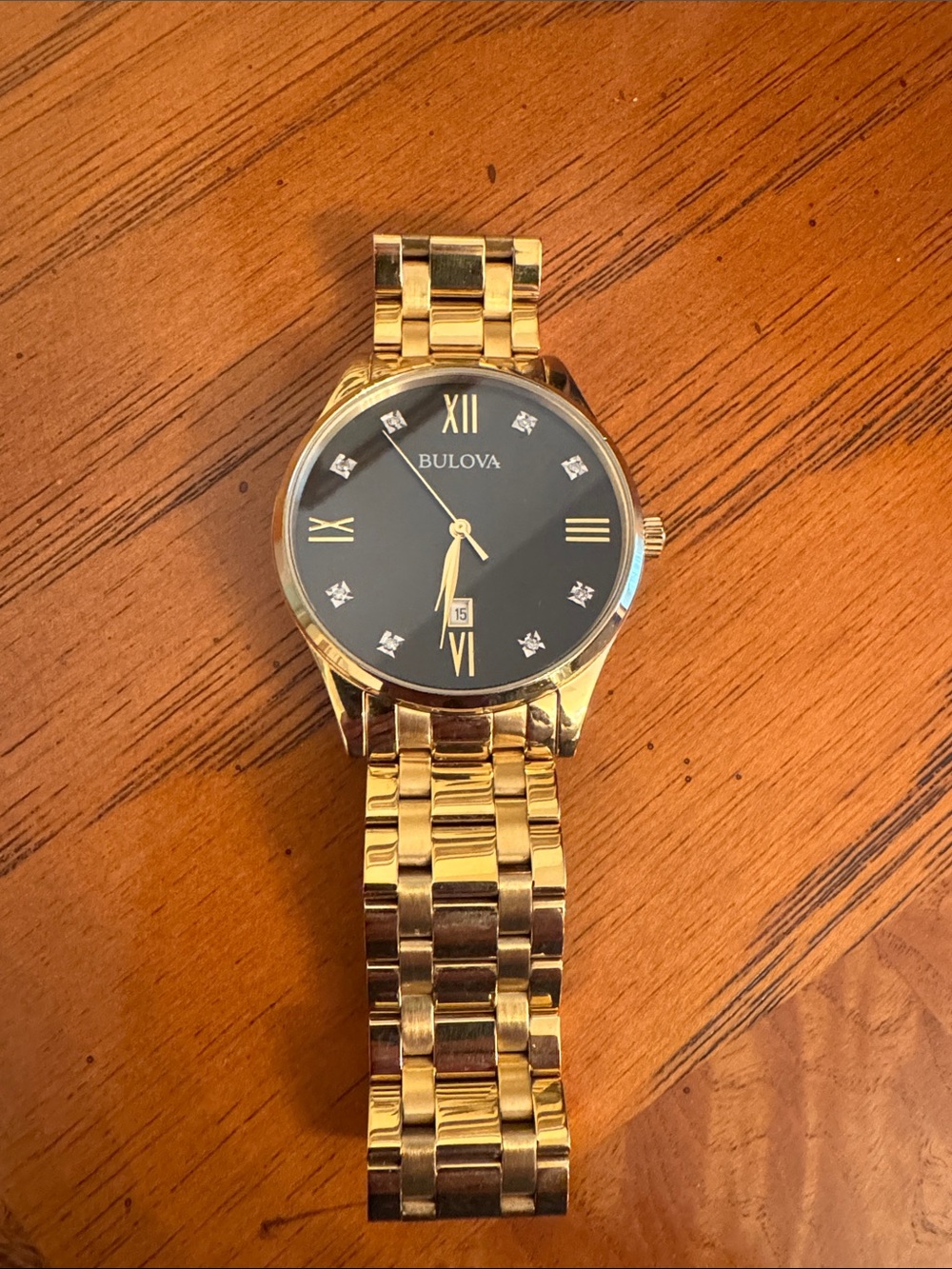 Bulova Gold and Black Men's Dress Watch with Crystal Accents